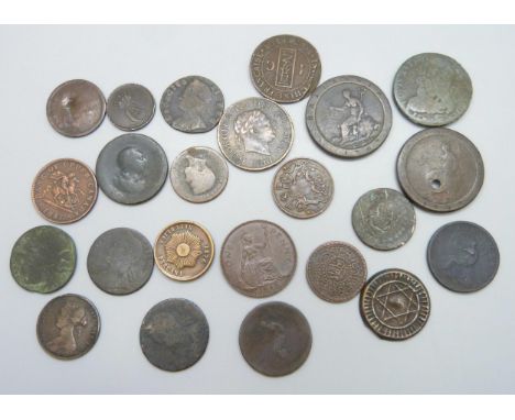 A collection of copper bronze coins including a Canadian half penny token 