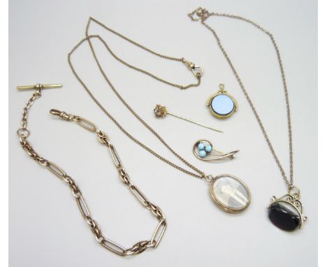 A collection of vintage jewellery including fobs, a locket, an Albert chain, etc.