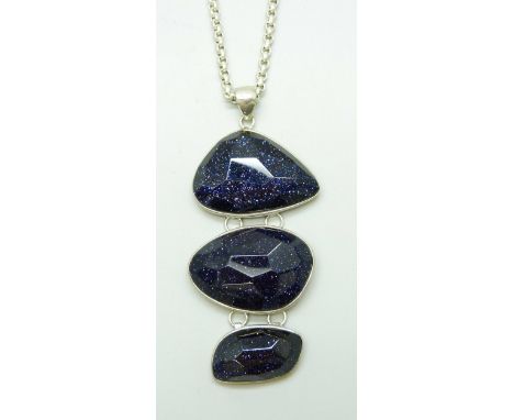 A midnight blue Goldstone silver pendant and chain, 49g
