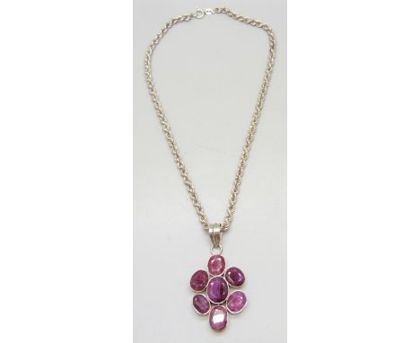 A silver mounted ruby pendant on a chain, 23g
