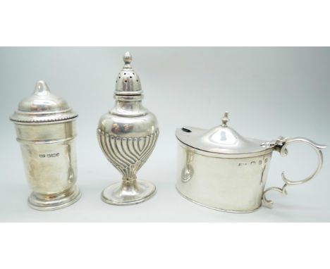 A silver mustard pot with blue glass liner and two silver salt shakers, 142g total weight