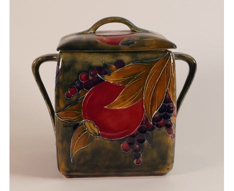 William Moorcroft two handled Biscuit Barrel &amp; cover, in the Arts &amp; Crafts pomegranate design, c1915, h18cm. r.