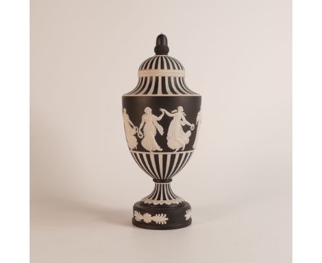 Wedgwood, dip black Jasperware 'Dancing Hours' vase and cover. Acorn finial lid on a sweeping shoulder striped in black and w