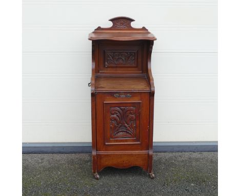 Late Victorian Purdonium coal scuttle. Carved pediment and front panel. Fitted gilt metal handles to front and sides. On bras