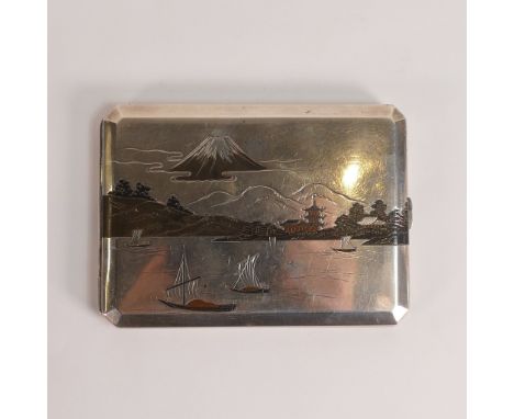 .950, Japanese export Niello Silver cigarette case. Decorated with cloud obscured Mt. Fuji above a fishing village scene to i