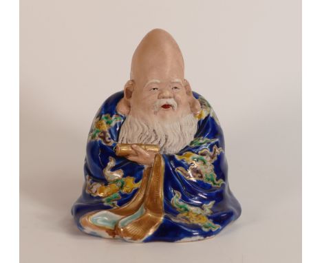 Republic Period (1911-1949) porcelain figure depicting seated Chinese deity Shou Lai. Decorated vivid Wucai enamel palette wi
