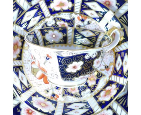 Royal Crown Derby, an extensive collection of Imari pattern 2451 comprising - dinner plates, side plates, tea trios, demitass