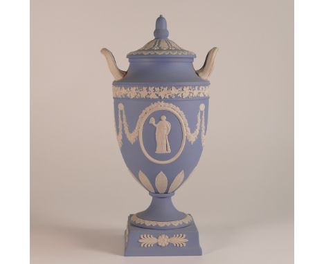 Wedgwood, blue Jasperware twin handled lidded urn. acorn finial moulded lid. Impressed 'Wedgwood' marks and dated for 1972. H