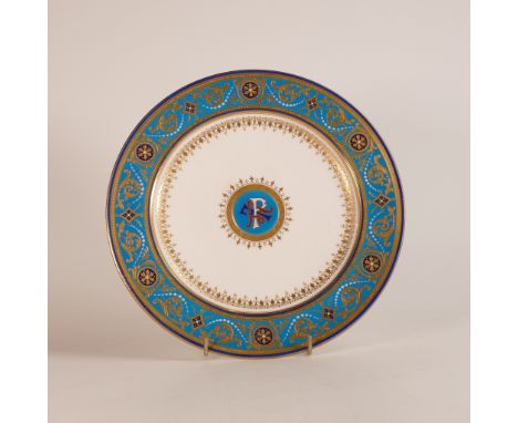 Mintons for Phillips of London, monogrammed Celeste-bleu ground dinner plate. Raised gilt border with jewelled decoration. Pu