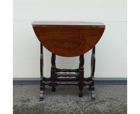 18th century gate leg Oak table. Of oval drop leaf form with Lyre shaped columns and turned wood gate leg action supports. He