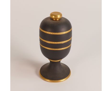 Wedgwood gold on black lidded footed jar. Decorated in 22ct gold with engine turned knurling techniques, made by Jon French (