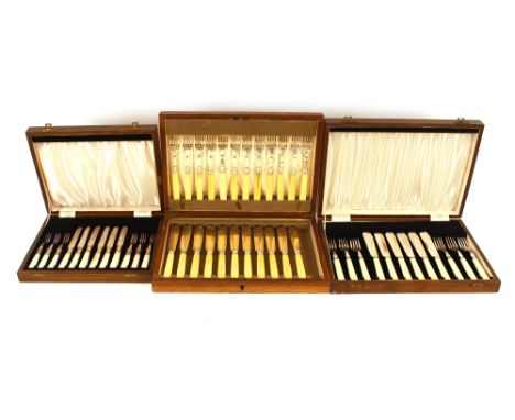 A cased set of twelve each silver bladed fish knives and forks,&nbsp;Sheffield 1930, one knife missing; a cased set of six ea