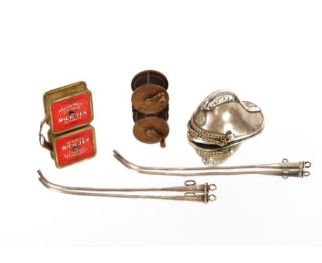An Antique miniature white metal fireman's helmet; a tape measure advertising MacFarlane Lang &amp; Co., Rich Tea biscuits; t