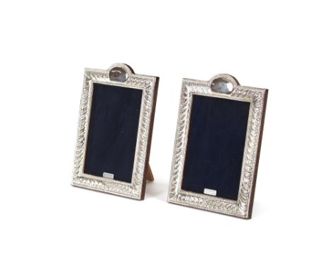 Two silver mounted easel photograph frames, with gadrooned border and vacant cartouche