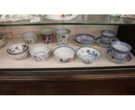 A small collection of 18th Century Worcester, famille rose and other tea bowls, modern Chinese tea bowls and saucers etc.