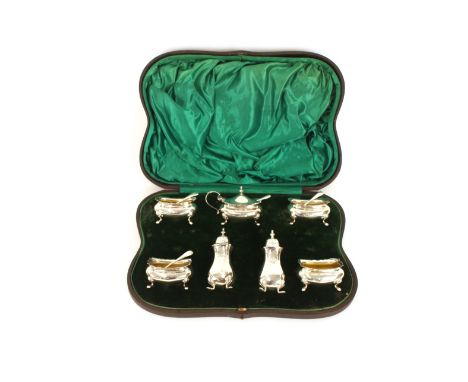 A cased silver matched seven piece cruet,&nbsp;with matched associated spoons mostly by Walker &amp; Hall&nbsp;