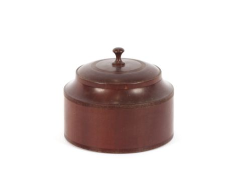 A late 19th / early 20th Century Lignum tobacco jar and cover,&nbsp;of circular form, slender finial and reeded edges, 14cm h