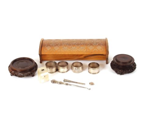 A carved olive wood trinket box,&nbsp;and contents to include a mother of pearl needle case, silver and plated napkin rings, 