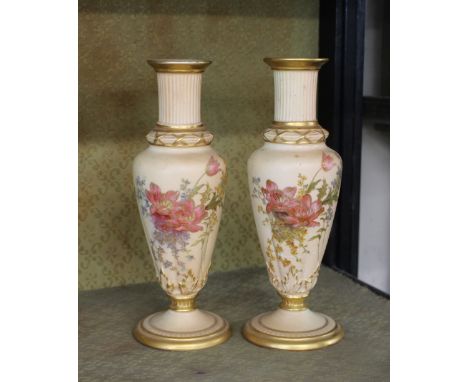 A pair of late 19th Century Royal Worcester vases,&nbsp;decorated floral sprays heightened in gilt on a blush ivory ground, r