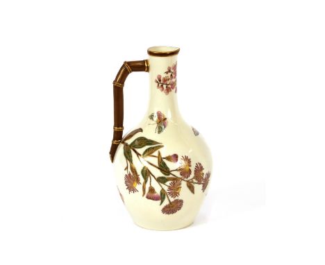 A Worcester baluster ewer,&nbsp;in the ascetic manner decorated floral sprays and butterflies heightened in gilt with branch 