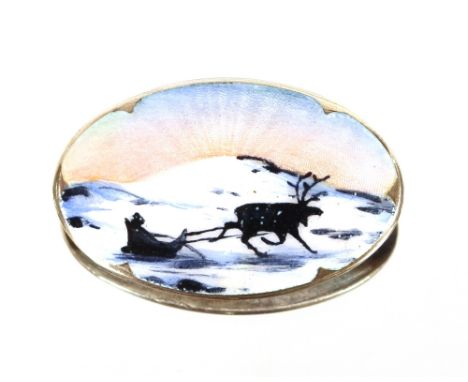 A .925 Scandinavian silver and enamel brooch, decorated with a sleigh scene