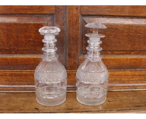 A pair of 19th Century Masonic glass decanters, with hob-nail and split decoration, triple ring necks etched with various sym