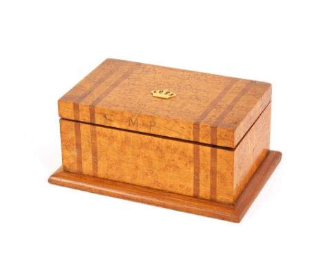 A burr walnut trinket box, with coronet decoration to the top, stamped M &amp; P; an amber coloured necklace with small facet