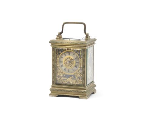 An attractive and unusual late 19th / early 20th century French brass carriage clock with tri-colour mask mounts and repeatth
