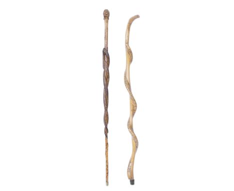 Of Aboriginal interest: Two snake carved wood walking sticks, probably early 20th centuryone carved with two intertwined snak