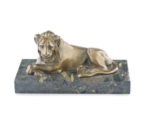 A late 19th / early 20th century 'Grand Tour' type patinated bronze model of a recumbent lionthe stylised hooded beast on a v