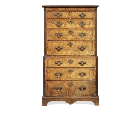 A George II figured walnut and featherbanded chest on chestCirca 1730, the ogee moulded cornice above a cavetto frieze, over 