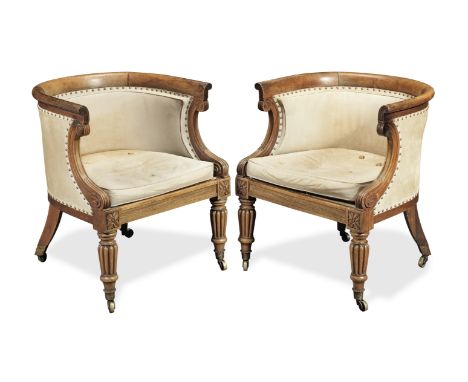 A pair of Regency rosewood 'curricle' or 'curule' bergeresCirca 1820, Each with a curved and dished toprail above lotus-leaf 