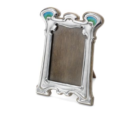 An Edwardian Art Nouveau silver and enamel photograph frameGeorge Lawrence Connell, London 1903 Shaped-rectangular with blue 