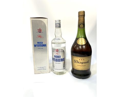 A bottle of Bisquit Cognac, 1 litre; a bottle of Wodka Wyborowa pure grain vodka, boxed, 75cl.