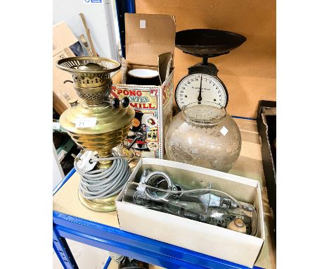 A repro glass oil lamp; a Spong coffee grinder; a graduating set of brass weights set of scales and mincer.