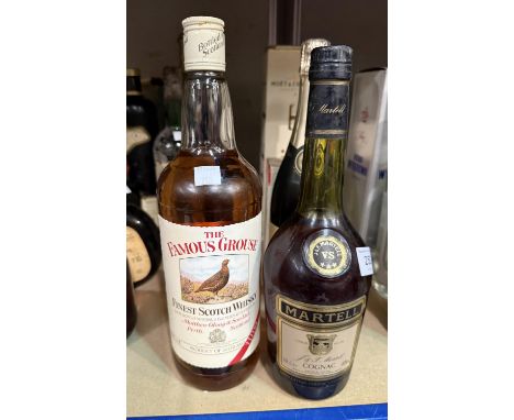 A bottle of Famous Grouse finest Scotch Whisky, 1 litre; a bottle of Martell Cognac, 68cl.