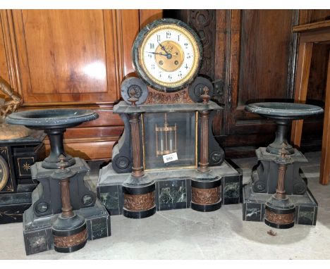 A French mercury pendulum marble mantel clock with copper columns.