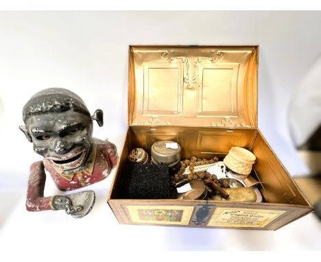 A Black Boy cast metal money box and a selection of collectors items including:- military badges, cigarette lighters, small b