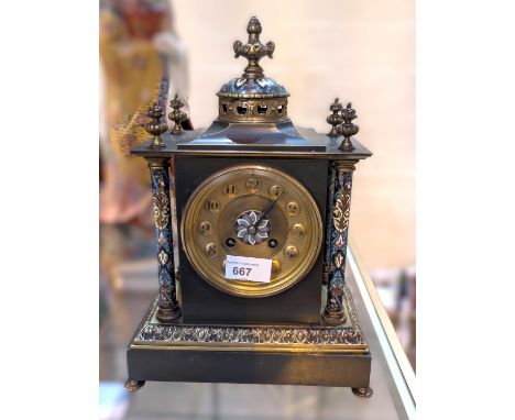 A French bronze and champ leves mantel clock with gilt dial.