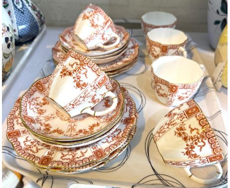 A Royal Crown Derby 18-piece part tea service decorated in amber transfer print.