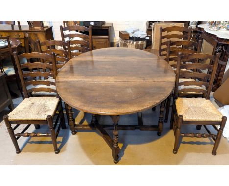 A Titchmarsh and Goodwin dining suite comprising large drop leaf oval dining table with two drawers to each end and 6 (4+2) r