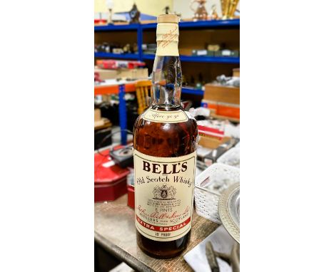 A vintage gallon bottle of Bells's Extra Special Old Scotch Whisky, 70% proof.