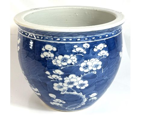 A Chinese 19th century blue and white prunus blossom planter/spitoon with four character mark to base, height 20cm, width 24c