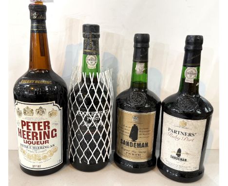A bottle of Sandeman Port; another Partner's Ruby port; Cockburn's Ruby and a litre of Peter Heering liqueur.