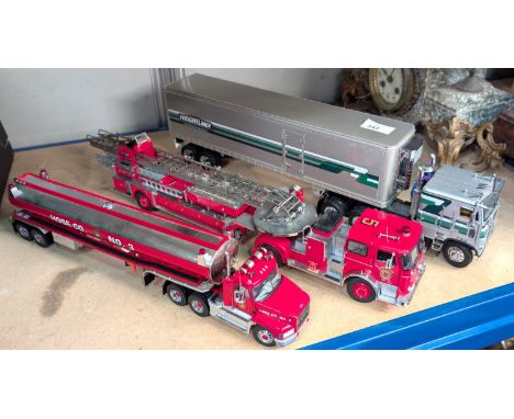 Three large scale diecast vehicles, a Fire Engine, a tanker and a freighter.