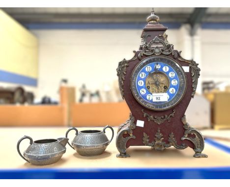 A French mantle clock with brass fittings, chiming movement etc.