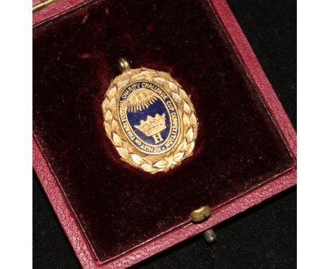 A cased late Victorian 9ct gold football medal, 1.25in.