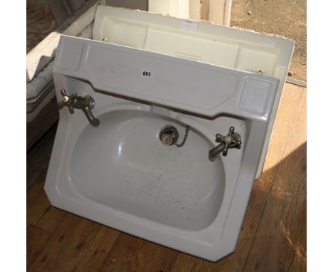 A Twyford & Sons Duramant wash basin, with taps, another similar wash basin and a pedestal