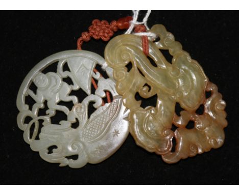 A Chinese celadon and russet jade plaque and a hardstone plaque.