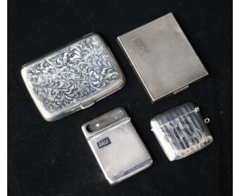A silver cigarette case, a compact, a vesta and a match case.